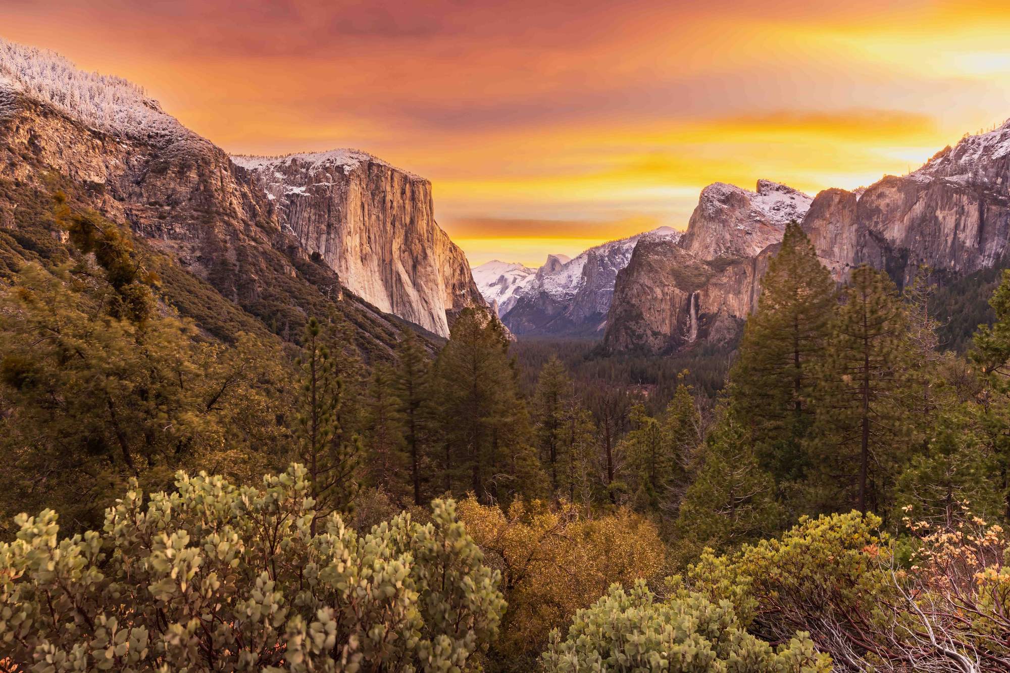 Yosemite Valley — granite walls, mist, and storm light at dawn